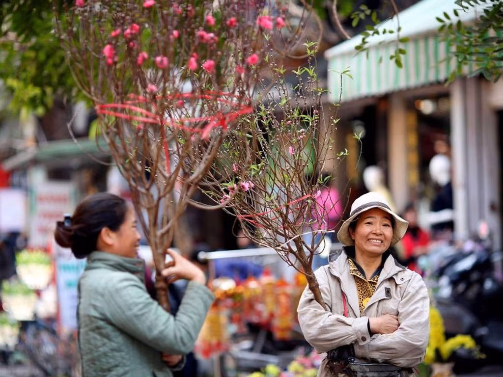 Người lao động sẽ được nghỉ Tết Nguyên đán từ 29 tháng Chạp đến mùng 5 tháng Giêng. Ảnh: EPA / Lương Thái Linh Người lao động sẽ được nghỉ Tết Nguyên đán từ 29 tháng Chạp đến mùng 5 tháng Giêng. Ảnh: EPA / Lương Thái Linh