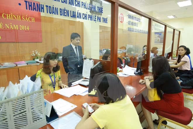 Cải cách thủ tục hành chính là nhiệm vụ quan trọng phát triển kinh tế. ảnh: TTXVN.