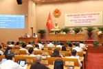 Giám đốc Sở Tài chính Hà Nội Nguyễn Xuân Lưu trình bày Tờ trình. Ảnh: hanoi.gov.vn.