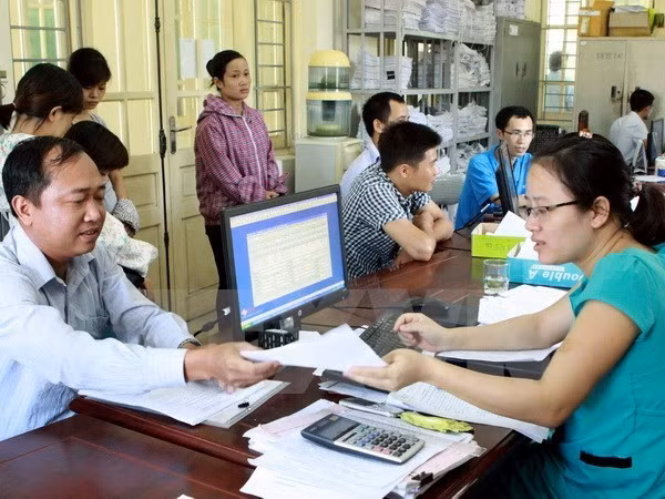 Nâng cao trình độ, năng lực của công chức, viên chức ngành Bảo hiểm xã hội nhằm đáp ứng tốt nhu cầu công việc. ảnh minh họa: TTXVN.