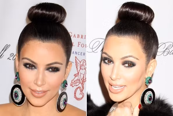 Kim Kardashian chọn kiểu tóc búi cao trên đỉnh đầu kết hợp với khuyên tai hình tròn to bản,với mái tóc này và trang điểm đậm đôi mắt trông cô nàng thật nổi bật khi đi dự tiệc.