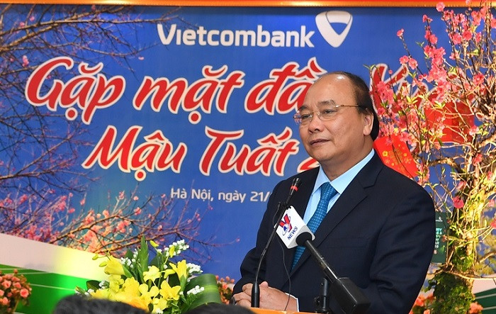 Thủ tướng Nguyễn Xuân Phúc phát biểu chúc Tết tập thể lãnh đạo và cán bộ nhân viên Vietcombank. Thủ tướng Nguyễn Xuân Phúc phát biểu chúc Tết tập thể lãnh đạo và cán bộ nhân viên Vietcombank.