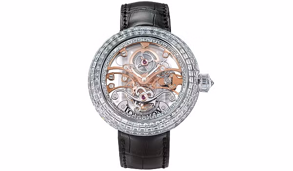 Jacob & Co – Trị giá 900.000 USD, Được làm từ 18 carat vàng trắng và gắn các tinh thể pha lê (Crystal Tourbillion) bao bọc bên ngoài mặt và có những viên kim cương nhỏ khoảng 17.48 carats. Dây quai được làm từ da cá sấu Mỹ và đính một viên kim cương khoảng 2.22 carat ở phần khóa. Jacob & Co – Trị giá 900.000 USD, Được làm từ 18 carat vàng trắng và gắn các tinh thể pha lê (Crystal Tourbillion) bao bọc bên ngoài mặt và có những viên kim cương nhỏ khoảng 17.48 carats. Dây quai được làm từ da cá sấu Mỹ và đính một viên kim cương khoảng 2.22 carat ở phần khóa.