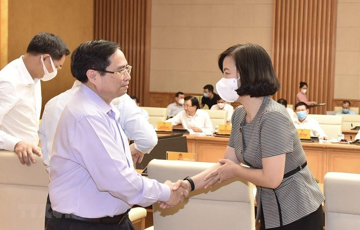 Thủ tướng Phạm Minh Chính và bà Vũ Việt Trang, Phó Tổng Giám đốc TTXVN.