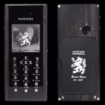Mobiado Professional EM: là chiếc điện thoại làm từ gỗ với kiểu dáng hao dao giống điện thoại của Nokia. Mobiado Professional EM là điện thoại đầu tiên của hãng có các phím bấm được làm từ titanium. Modiado chỉ sản xuất 200 phiên bản và mỗi chiếc điện thoại được khắc số phía sau thân máy. Giá bán 1.900 USD Mobiado Professional EM: là chiếc điện thoại làm từ gỗ với kiểu dáng hao dao giống điện thoại của Nokia. Mobiado Professional EM là điện thoại đầu tiên của hãng có các phím bấm được làm từ titanium. Modiado chỉ sản xuất 200 phiên bản và mỗi chiếc điện thoại được khắc số phía sau thân máy. Giá bán 1.900 USD