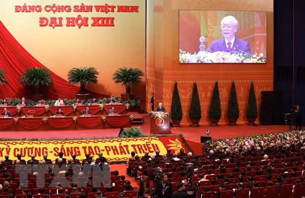 Đại hội nghe Tổng Bí thư Ban Chấp hành Trung ương Đảng, Chủ tịch nước Cộng hòa Xã hội Chủ nghĩa Việt Nam Nguyễn Phú Trọng đọc Báo cáo chính trị của Ban Chấp hành Trung ương Đảng khóa XII và các văn kiện trình Đại hội. (Ảnh: TTXVN)