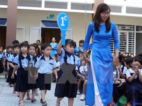 Tựu trường cũng là ngày khai giảng là điều rất có ý nghĩa với cả học sinh và giáo viên. (Ảnh minh hoạ: TTXVN) Tựu trường cũng là ngày khai giảng là điều rất có ý nghĩa với cả học sinh và giáo viên. (Ảnh minh hoạ: TTXVN)