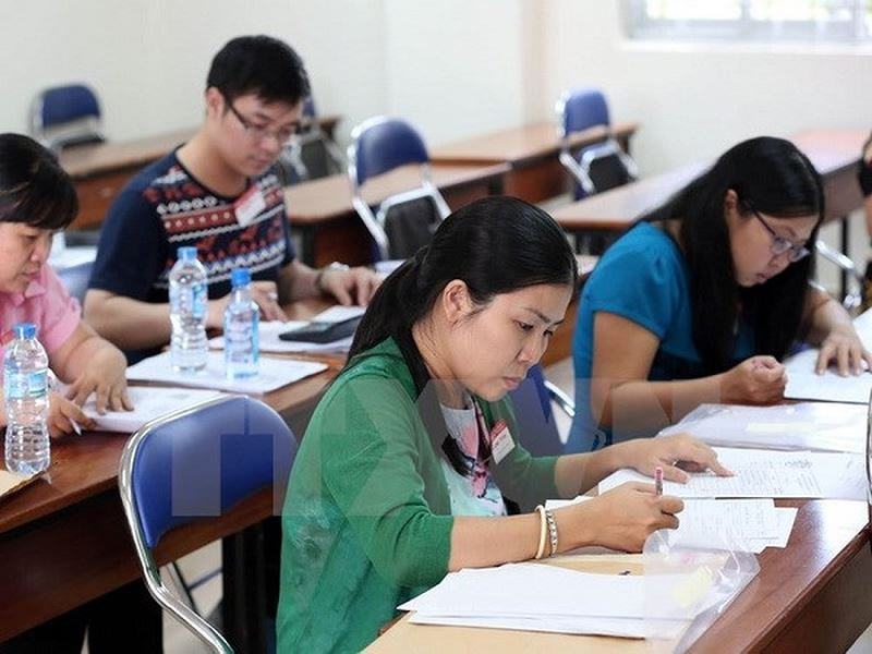 Chấm thi luôn được xem là một nhiệm vụ rất vất vả, nặng nề. (Ảnh minh họa: TTXVN)