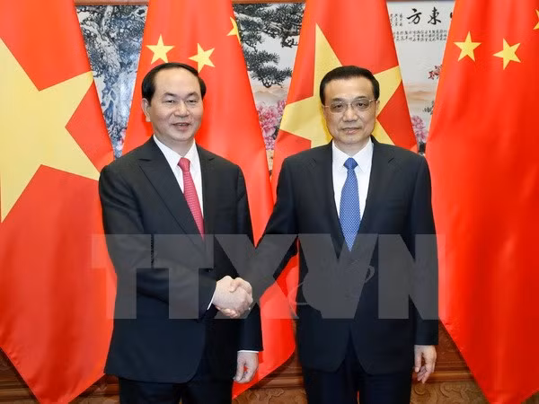 Chủ tịch nước Trần Đại Quang gặp Thủ tướng Trung Quốc Lý Khắc Cường. (Ảnh: Nhan Sáng/TTXVN)
