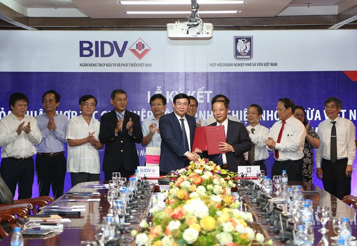 BIDV và Hiệp hội doanh nghiệp Nhỏ và Vừa Việt Nam (VINASME) ký kết thỏa thuận hợp tác toàn diện nhằm mục đích hỗ trợ và phát triển doanh nghiệp vừa và nhỏ. BIDV và Hiệp hội doanh nghiệp Nhỏ và Vừa Việt Nam (VINASME) ký kết thỏa thuận hợp tác toàn diện nhằm mục đích hỗ trợ và phát triển doanh nghiệp vừa và nhỏ.